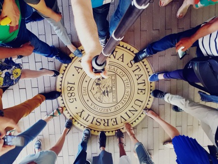 SUSI scholars' feet tapping the Arizona State University seal