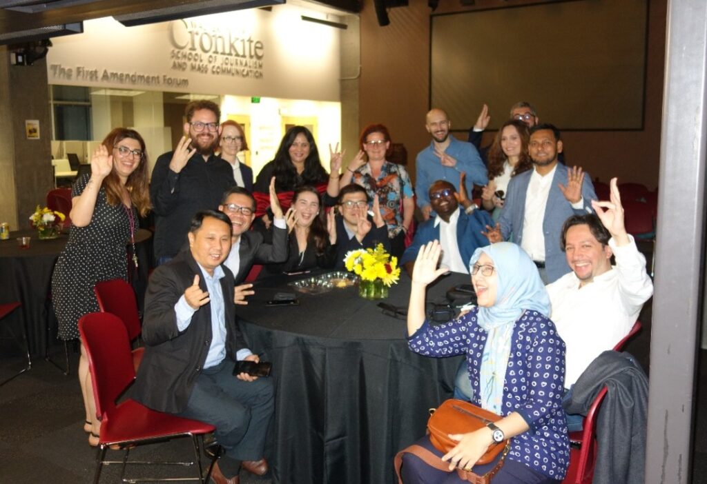 The SUSI 2022 Scholars give an ASU "Forks up!" salute