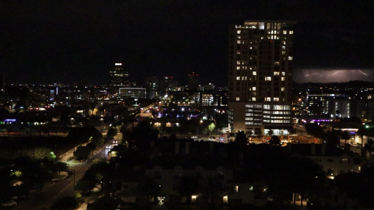 A monsoon storm against the Phoenix skyline at night