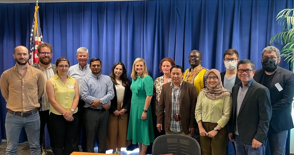 The SUSI scholars and instructor Dan Barr pose with Phoenix mayor Kate Gallego