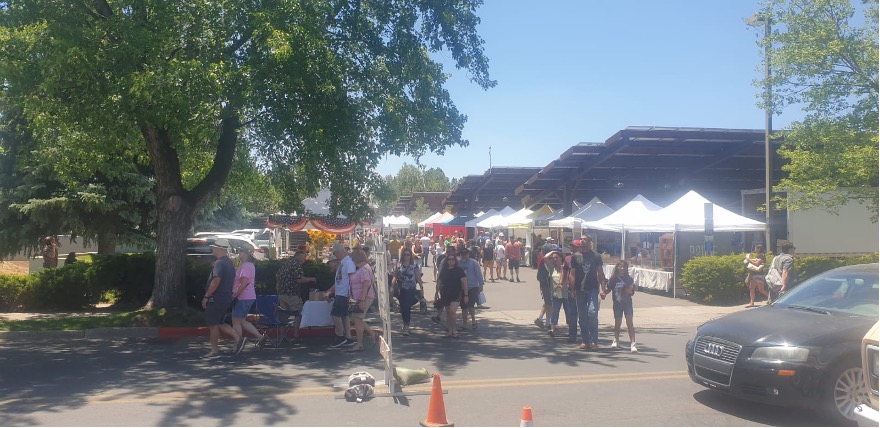 People gather at a Sunday street market in downtown Flagstaff