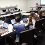 The scholars meet in a lab classroom for hands-on activities