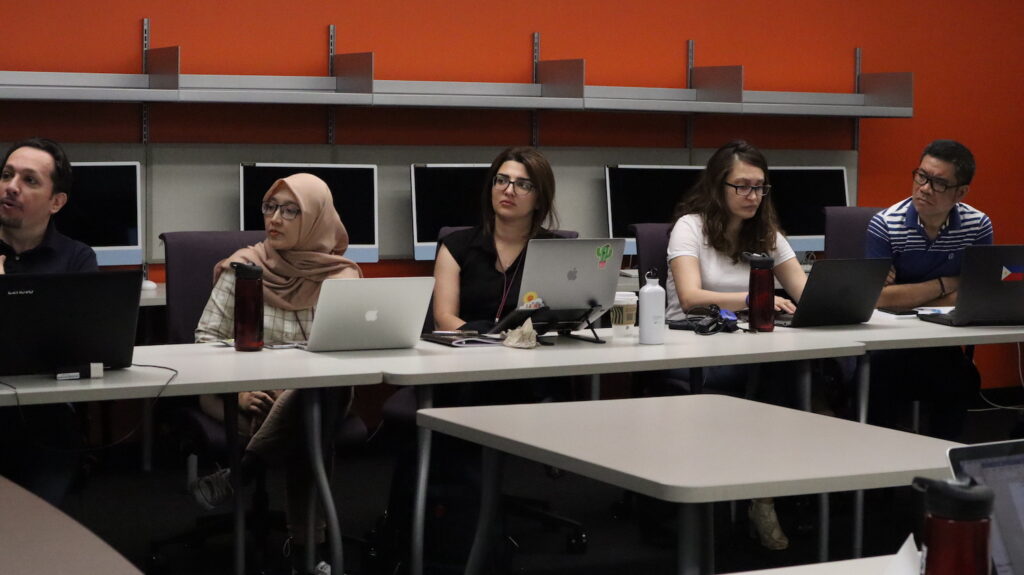 SUSI Scholars listen attentively during Dr. Kristy Roschke's lecture on disinformation