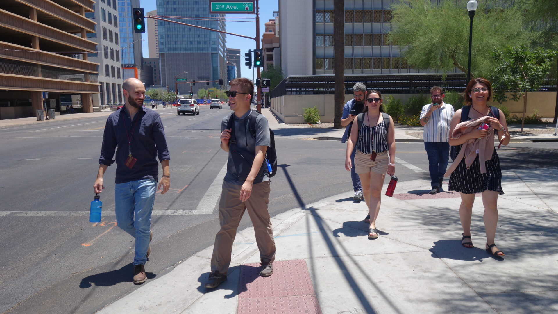 A group of scholars walk the streets of downtown Phoenix