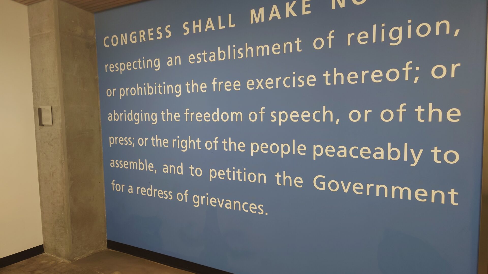 The text of the U.S. First Amendment on a wall at the Cronkite School