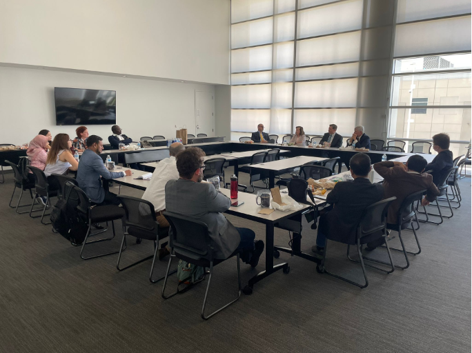 The scholars are seated in a roundtable setting for discussion with federal judges at the U.S. District Court in Phoenix, Arizona