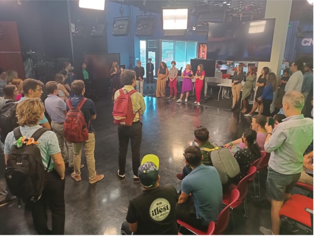 Cronkite News faculty and students gather to debrief the day's news gathering and production