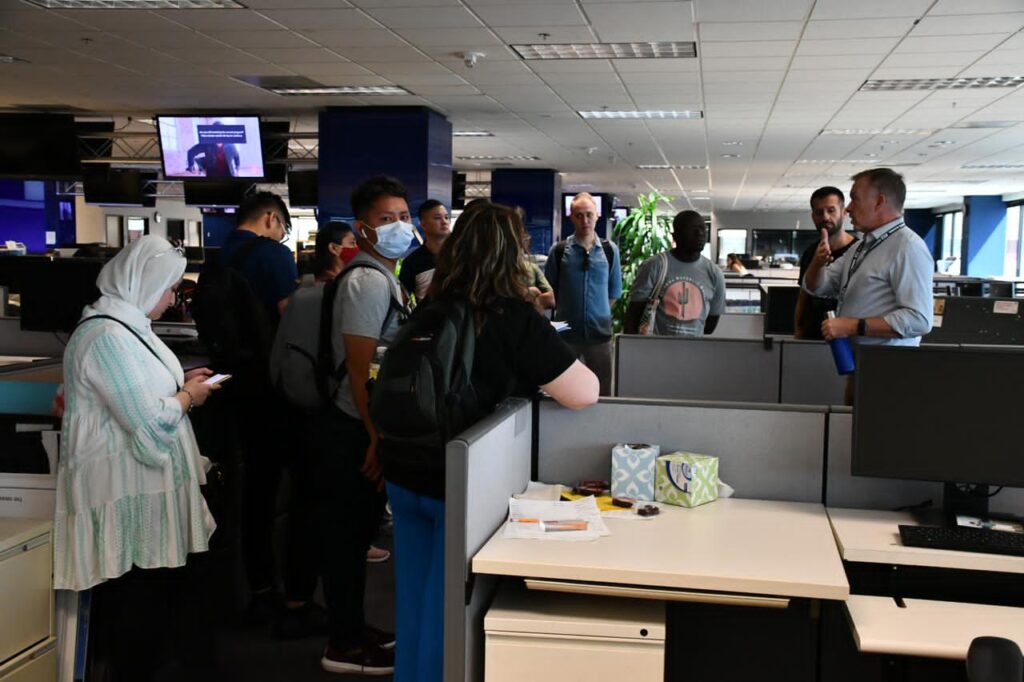 The scholars tour the Arizona Republic newsroom