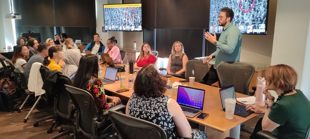 Dr. Joshua Garland talks to the scholars about countering harmful speech and behavior online