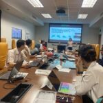 The scholars sitting around the conference table in Cronkite 444