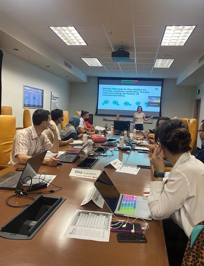 The scholars sitting around the conference table in Cronkite 444