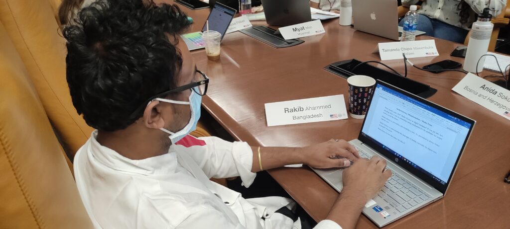 Rakib Ahammed of Bangladesh works on a definition of media literacy on his laptop