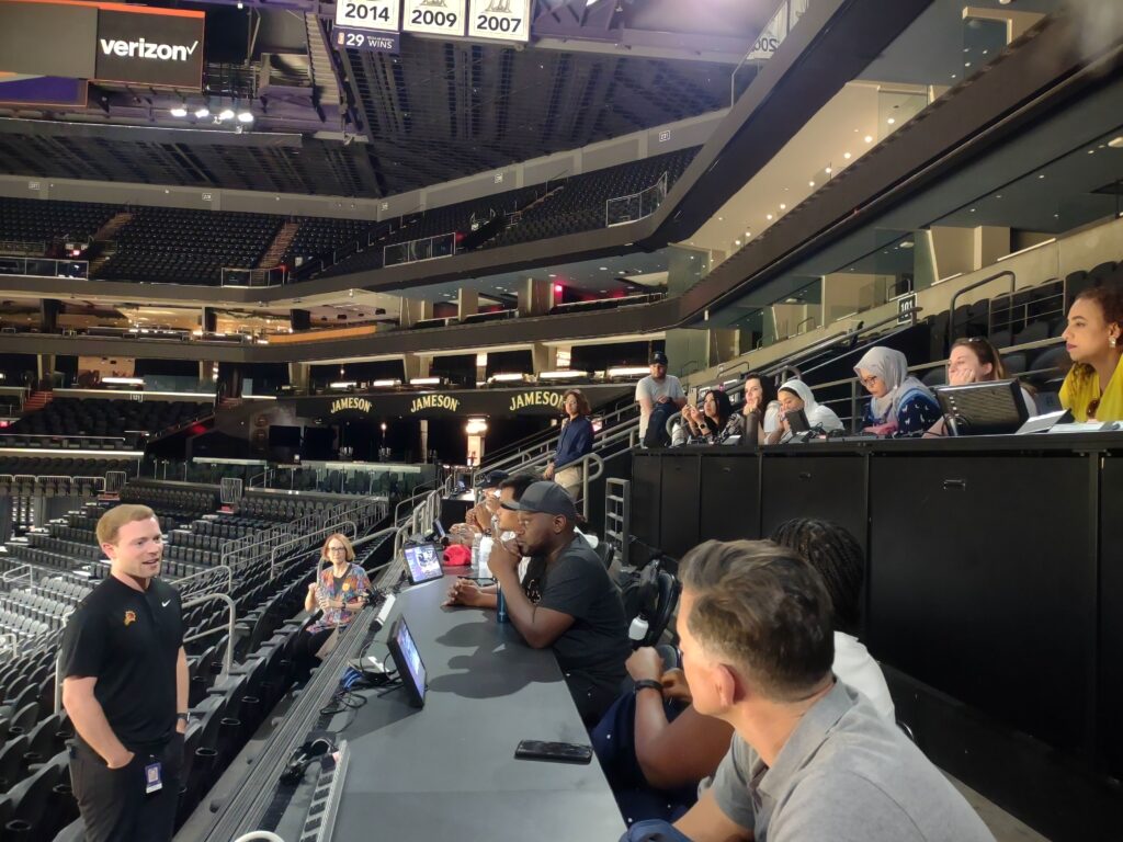 The Scholars sit in the press box at the Footprint Center, home to professional basketball in Phoenix