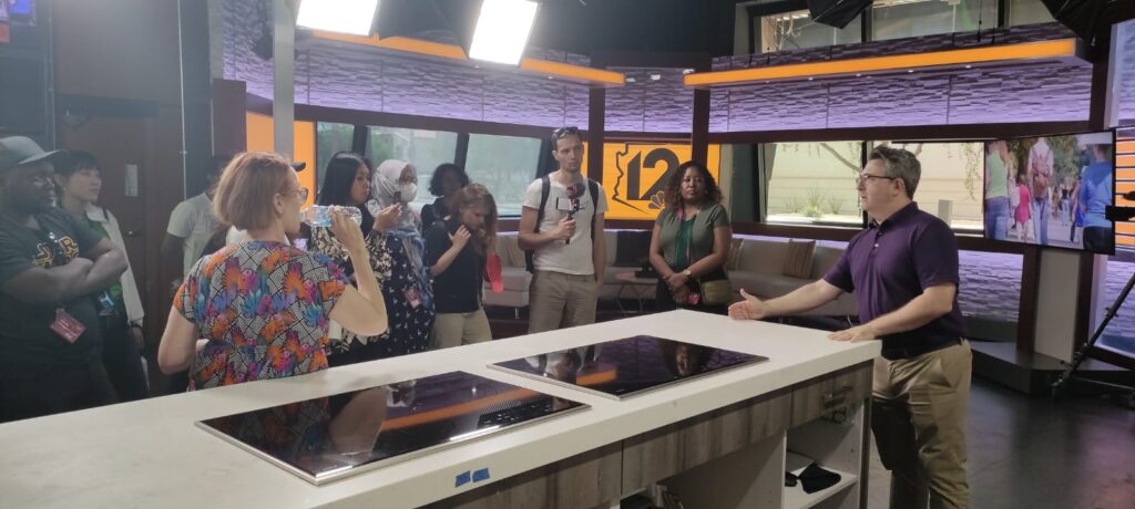 The scholars stand in the kitchen show area of the KPNX studios in Phoenix