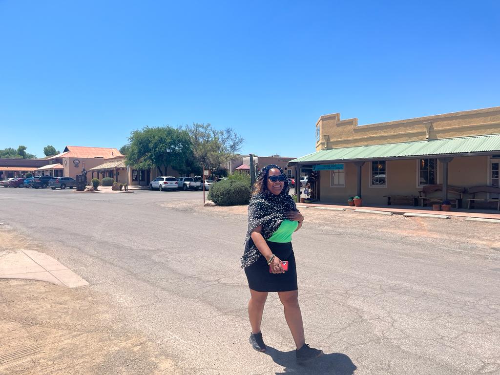 A scholar strolls through the center of Tubac