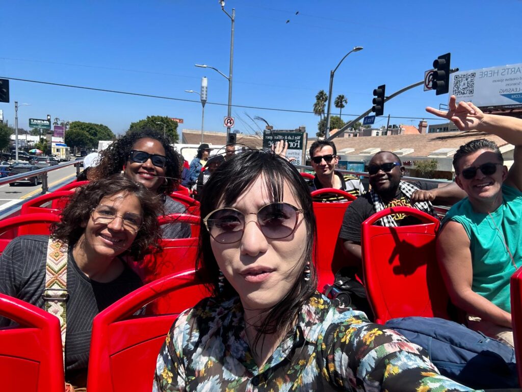 The scholars atop a double-decker tour bus in Los Angeles