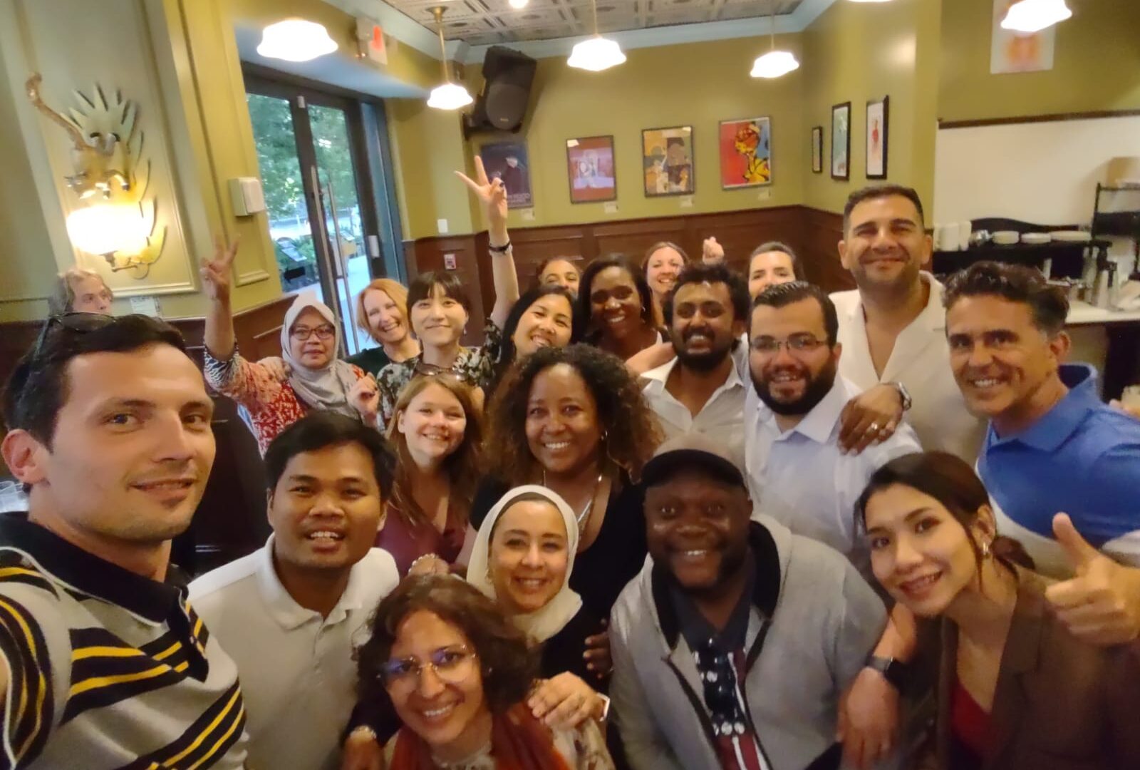 The Scholars pose for a group selfie at Busboys & Poets restaurant in Washington, D.C.