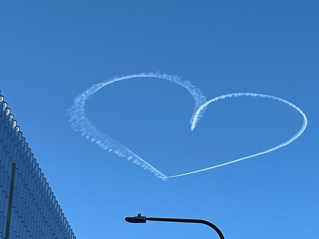 A white heart is outlined in the blue California sky