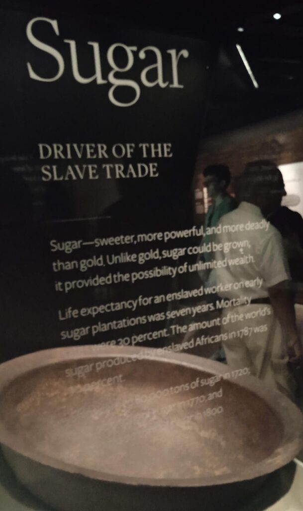 An explainer panel about the role of sugar commerce in driving the slave trade