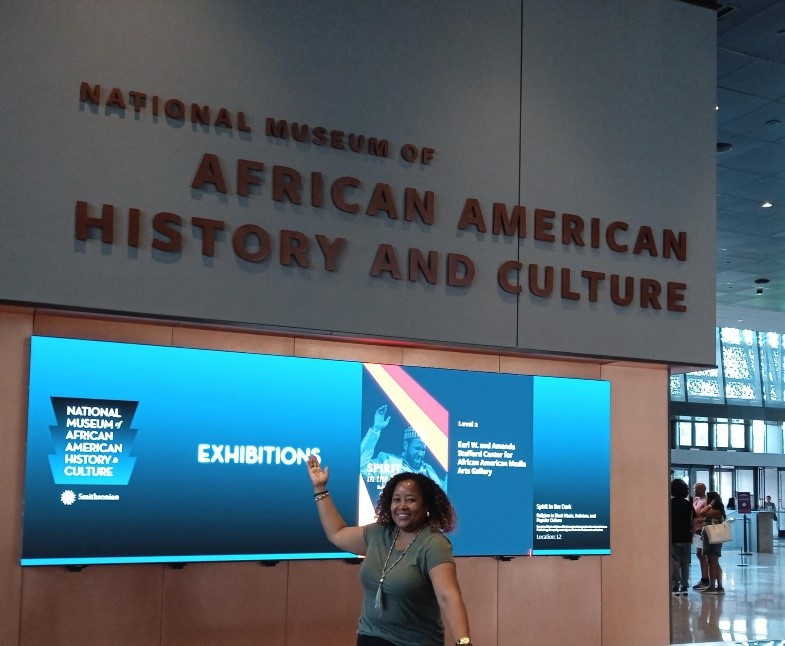 The entrance lobby and sign with the name of the National Museum of African American History and Culture