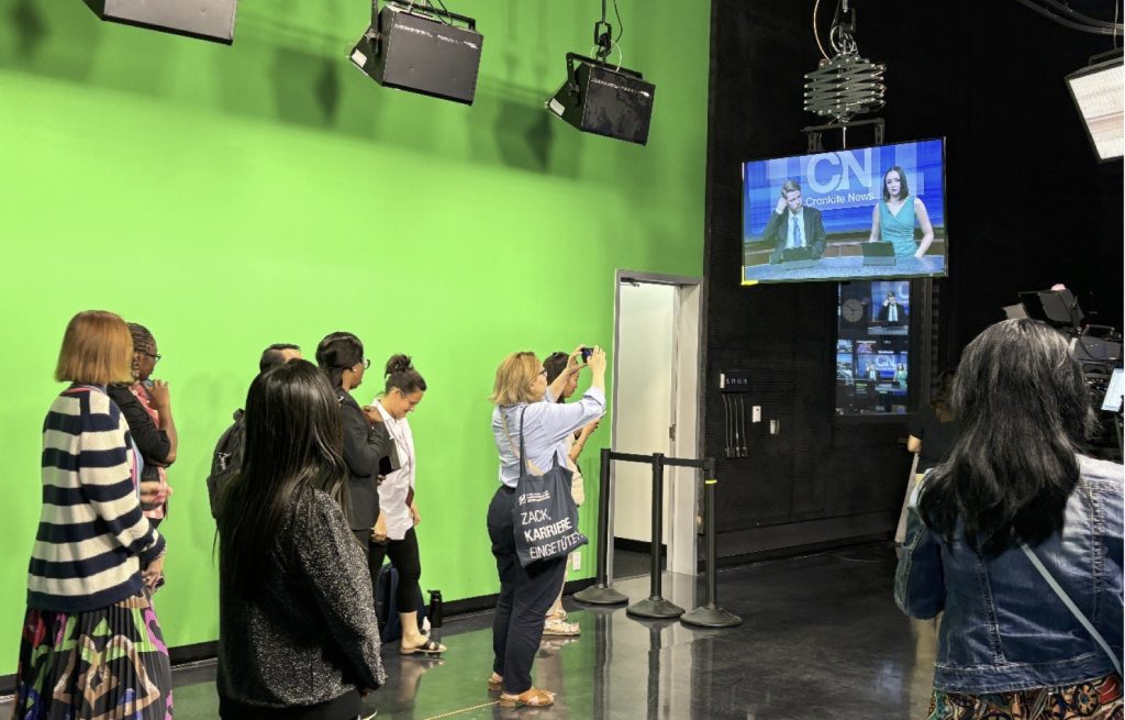 The scholars observed the rehearsal and taping of the newscast