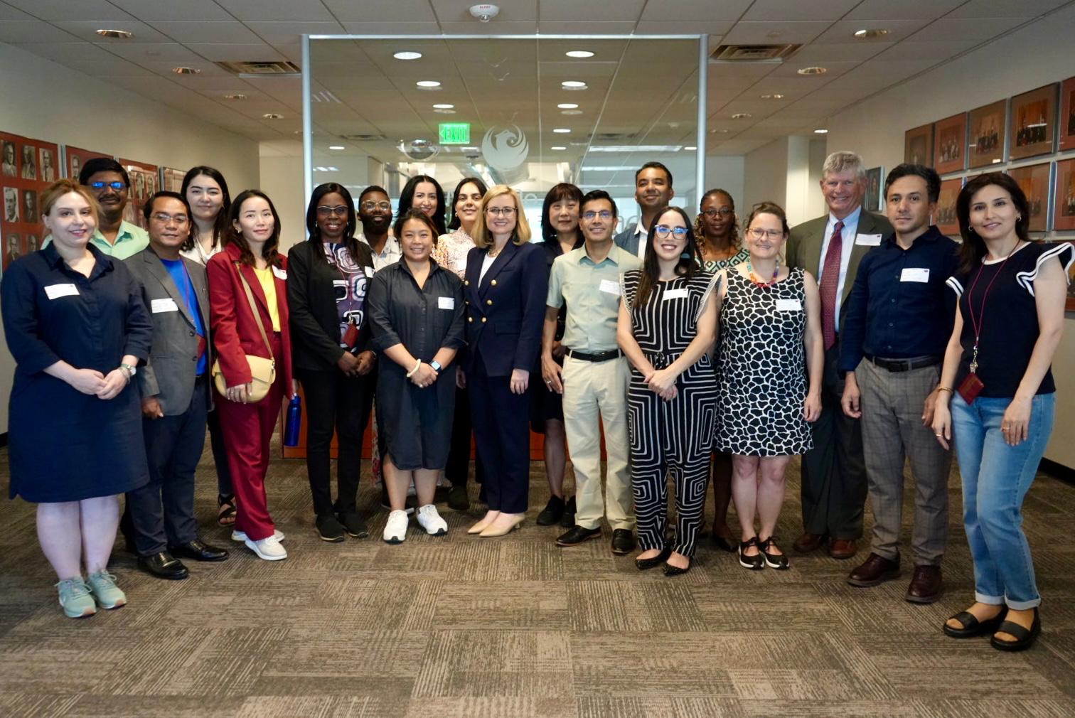 The scholars pose with Phoenix mayor Kate Gallego (center) at City Hall