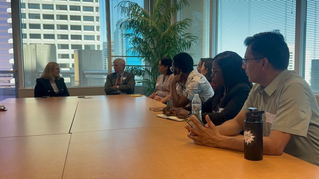 Mayor Kate Gallego and Chief Deputy Attorney General Dan Barr talk with the scholars around a conference table at City Hall