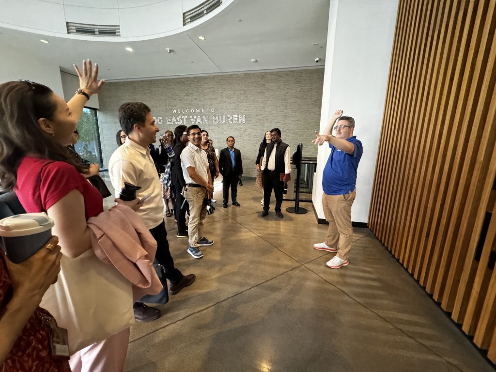 One scholar raises her hand to ask a question of Judd Slivka, director of digital content