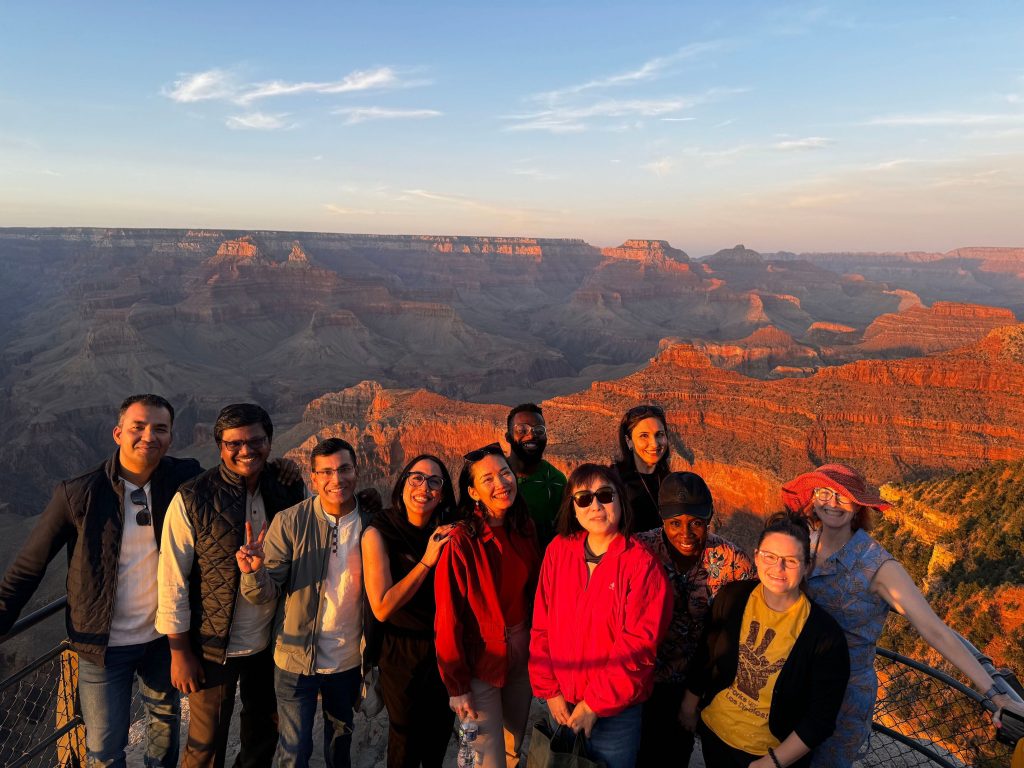 The majestic beauty of the Grand Canyon at golden hour, with sunset approaching, and SUSI Scholars taking it all in