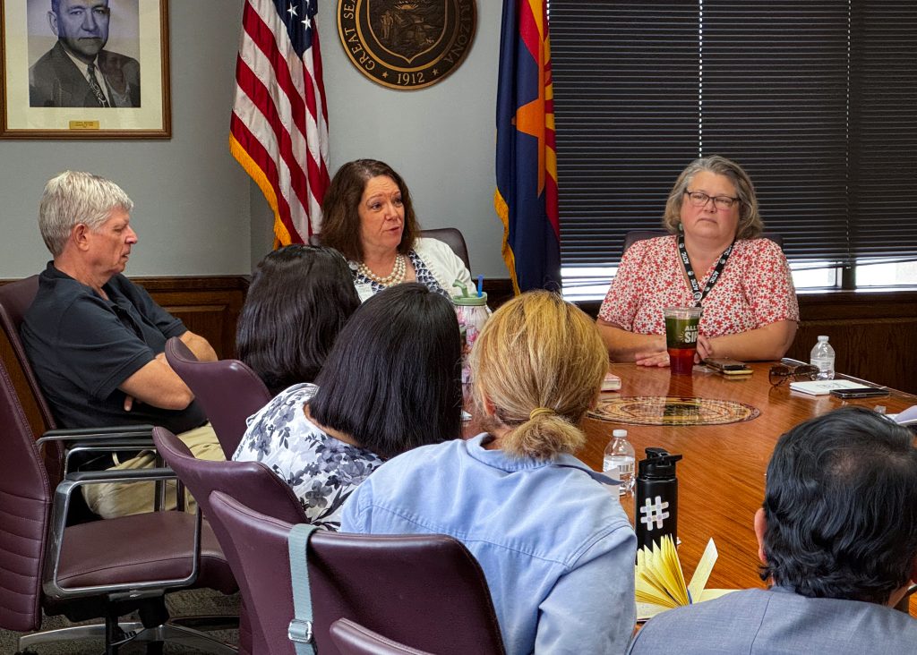 The scholars discuss election processes with staff at the Secretary of State's office