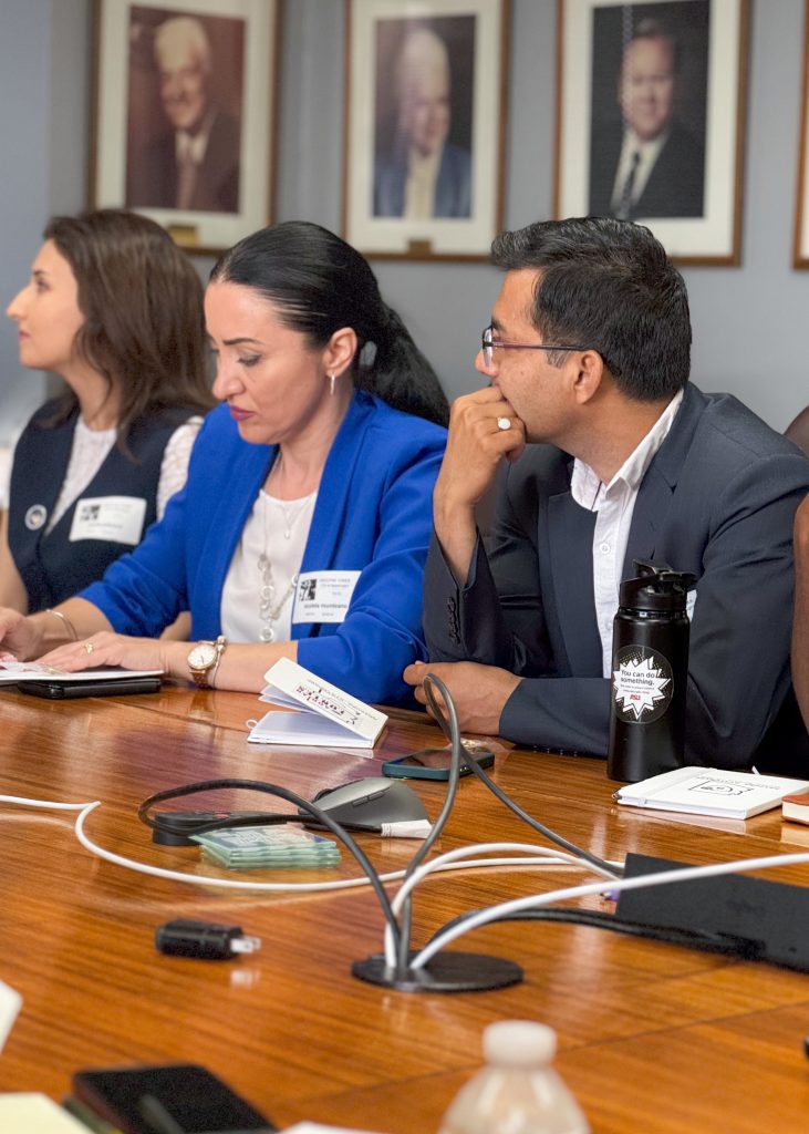 Three of the scholars deep in discussion during one of their sessions