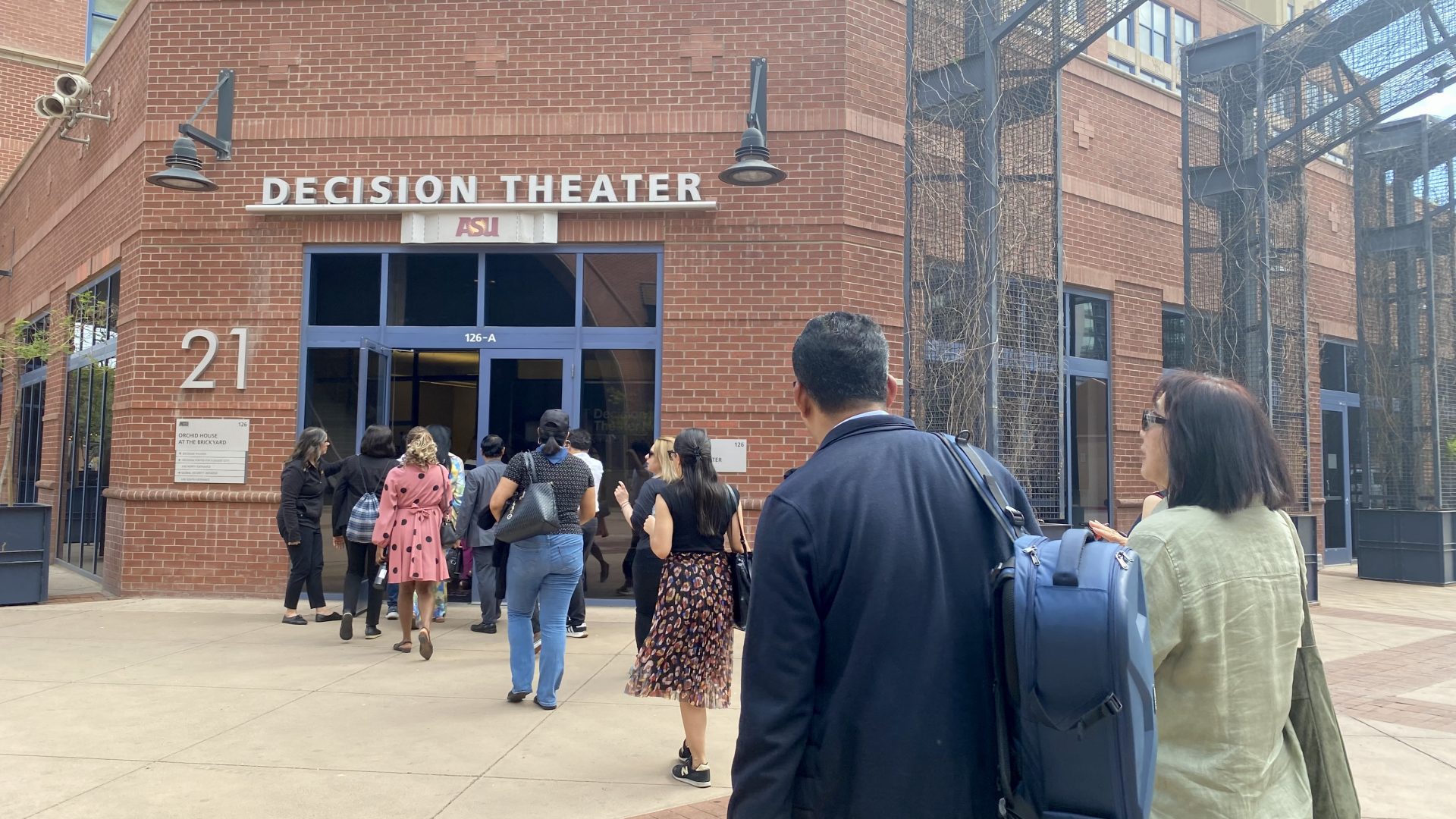 The scholars file into a building in the "Brickyard" section of ASU's Tempe Campus