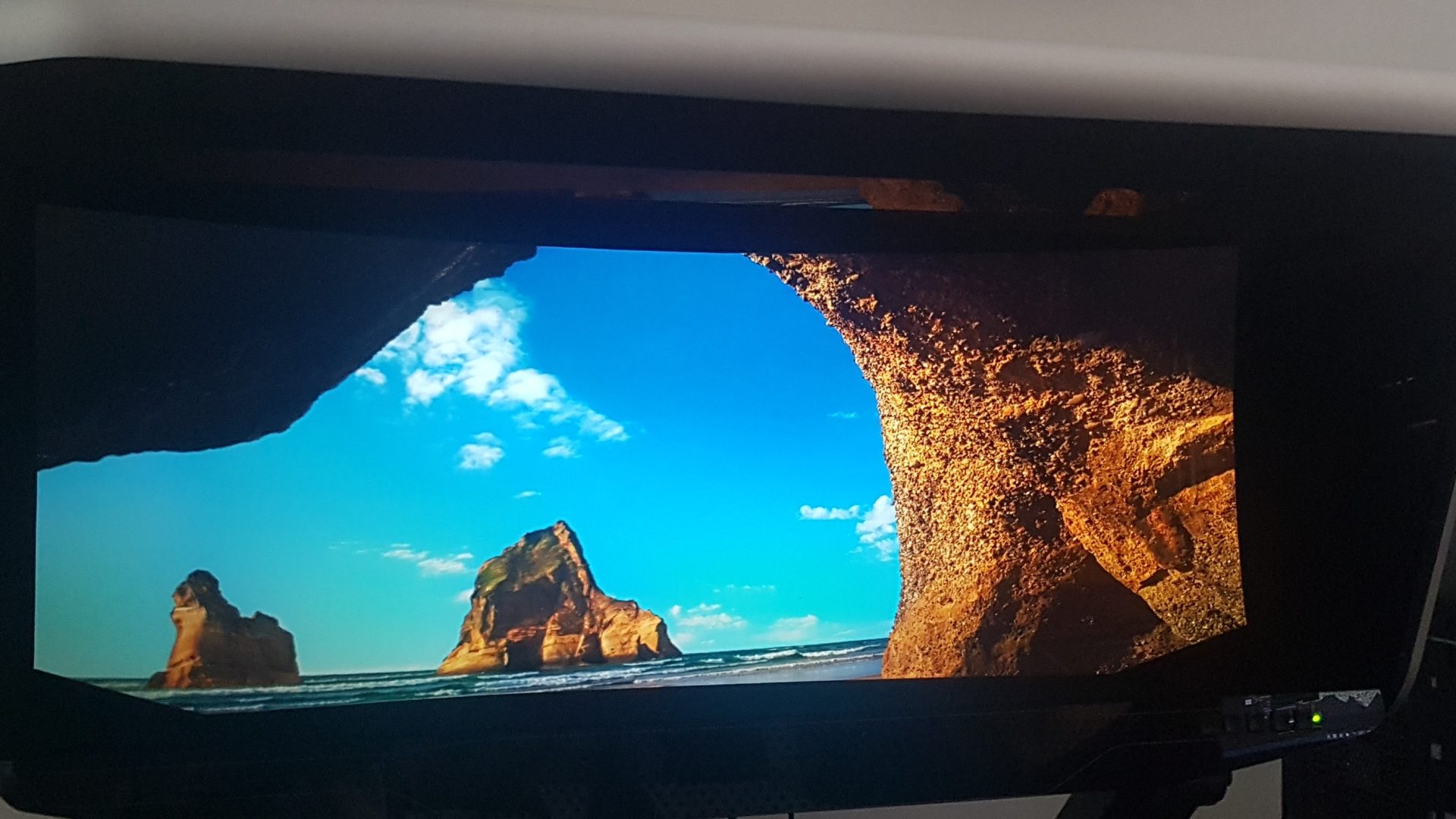 A virtual reality screen showing a seaside cave scene