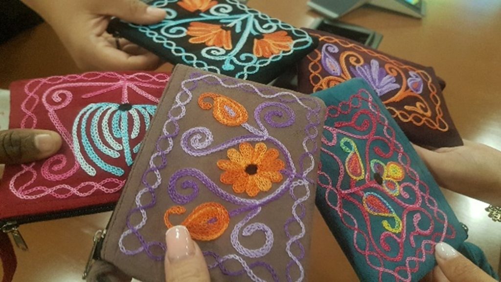 Close up of an assortment of handmade purses, a gift from one scholar to his colleagues