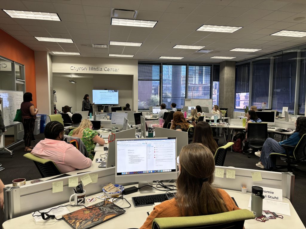 An open workspace with students attentively following a training on journalist safety