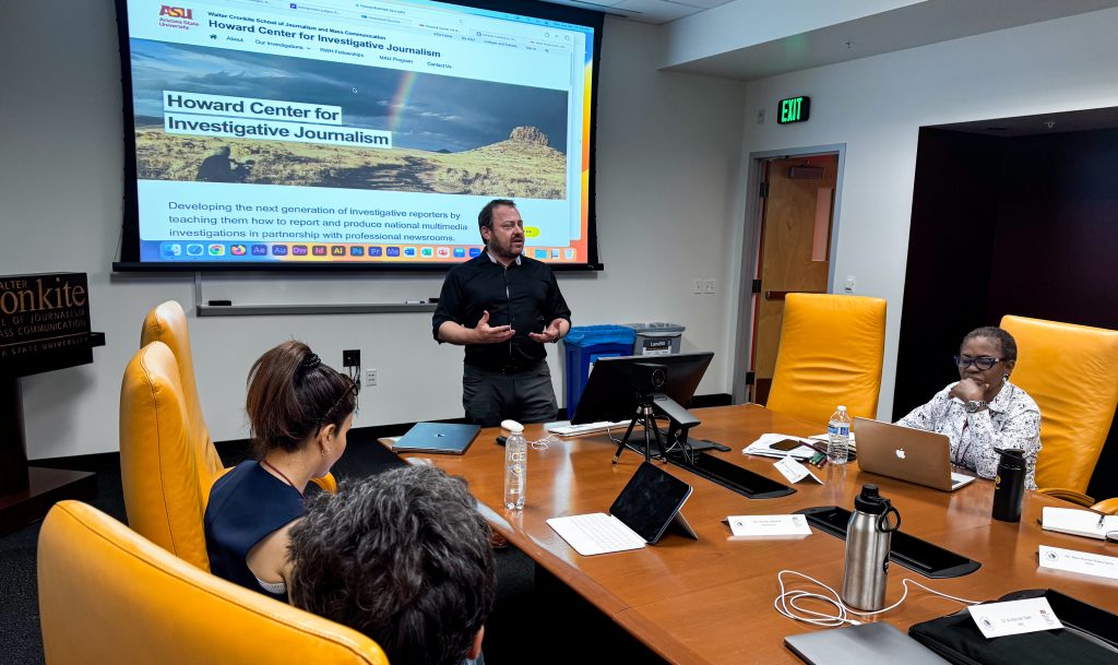 Mark Greenblatt explains to the scholars how the Howard Center trains students in the techniques and ethics of investigative journalism